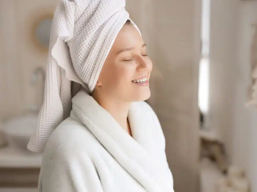 woman smiling in bathroom