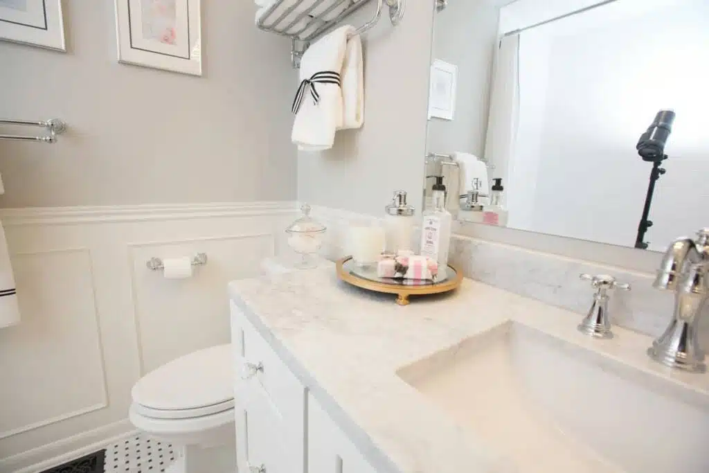 White cabinets and countertop in classic bathroom remodeling project.