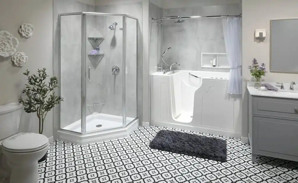 Black and white tiled bathroom floor and glass corner shower and accessible bathtub.