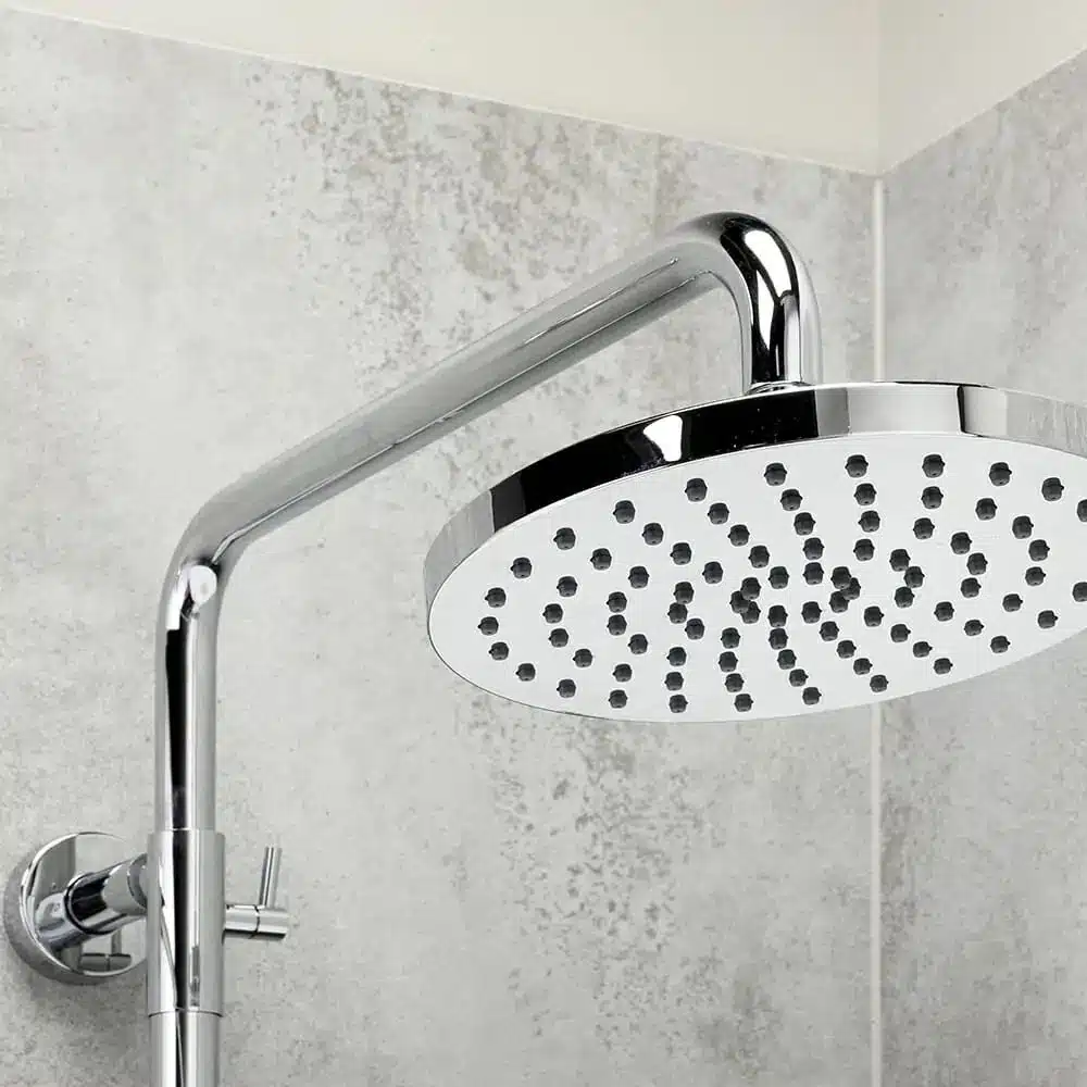 Polished chrome rainfall shower head closeup.