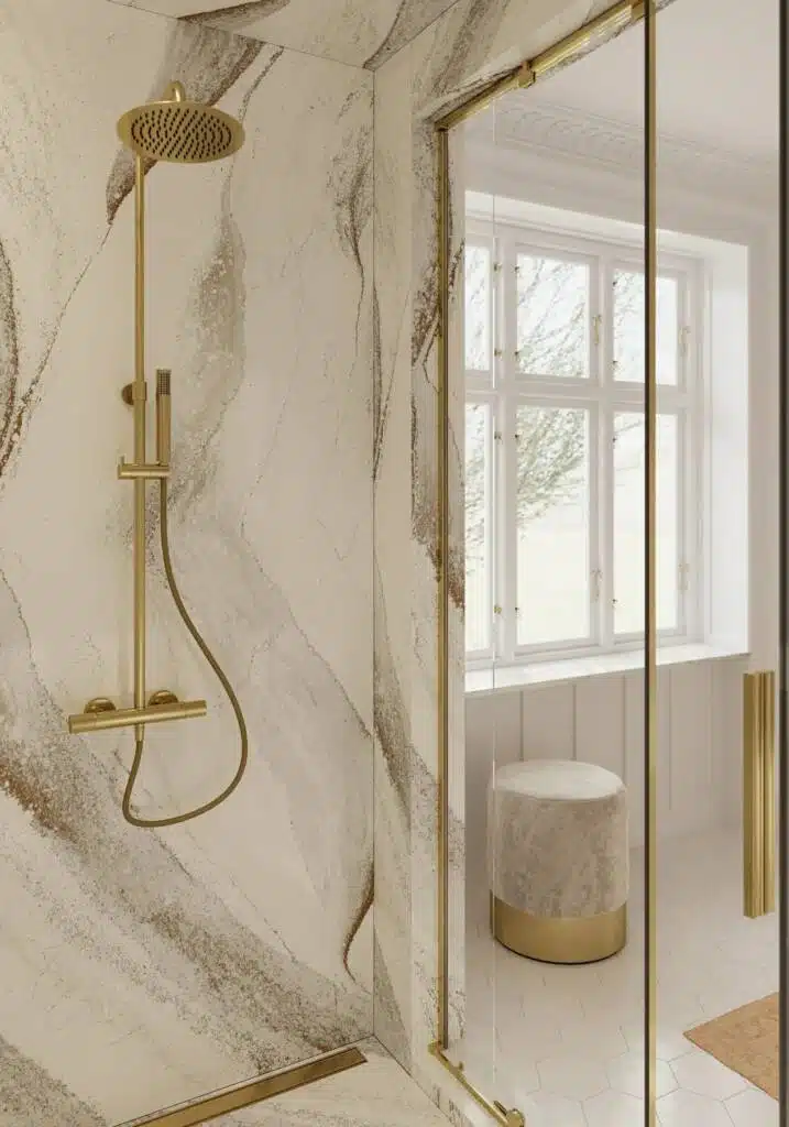 Gold accessories in solid white and grey marbled shower.