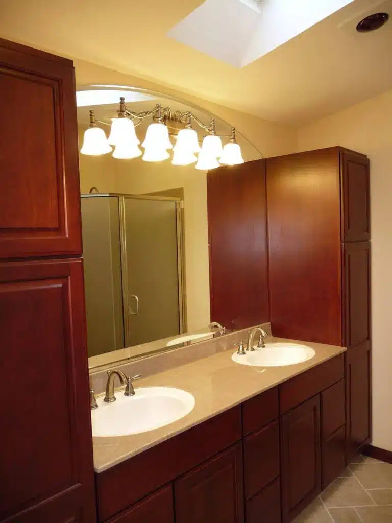 Couples bathroom design with double floor-to-ceiling cabinets by Columbus Bath Design in Lewis Center, Ohio.