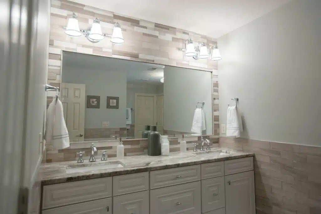 Clean couples bathroom counter and large vanity.