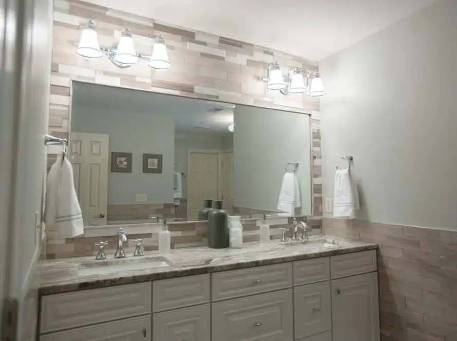 Clean couples bathroom counter and large vanity.