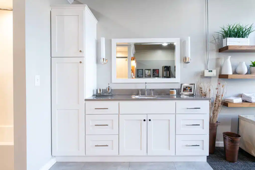 A bathroom cabinet, mirror, and countertop display at Columbus Bath Design's Design Center in Lewis Center, Ohio.