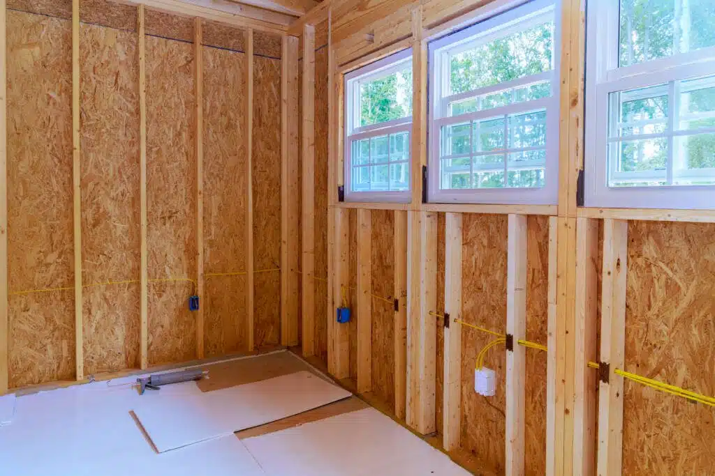 Bathroom demolition during remodeling project exposed wood framing.