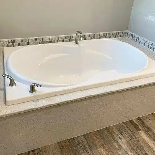 The Onyx Collection materials used in a tiled bathroom tub remodel.